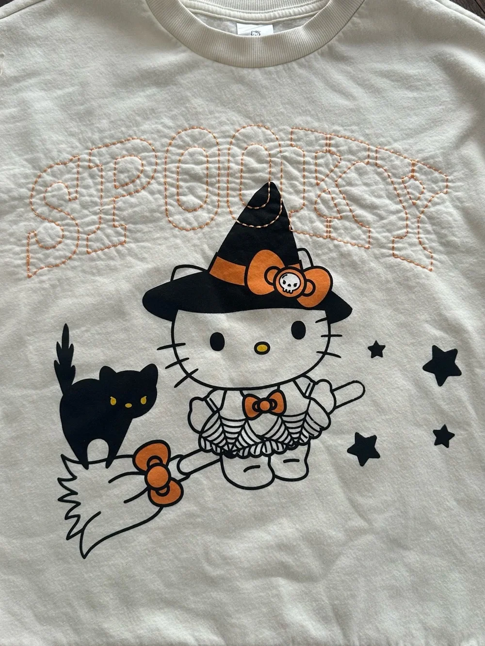 Hello Kitty Cream Crewneck Sweater with Black Star Accents